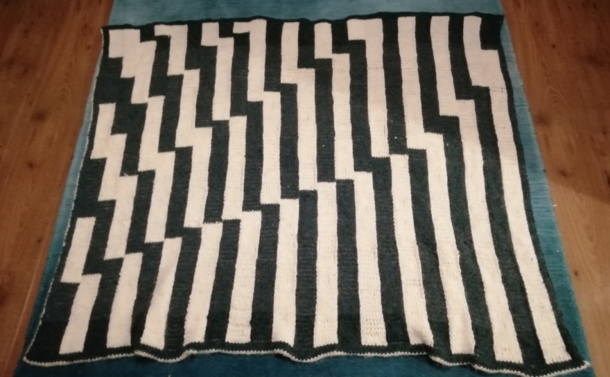 Knitted blanket in two colours with stripes